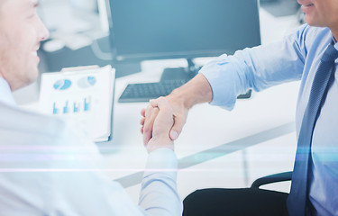 Image showing businessmen shaking hands in office