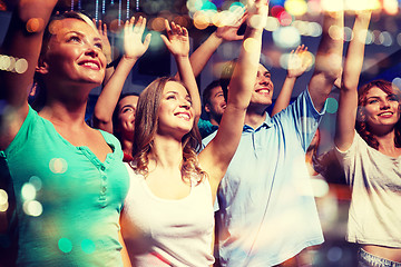 Image showing smiling friends at concert in club