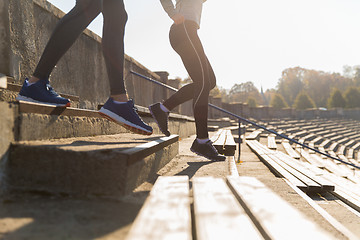 Image showing close up of couple running downstairs on stadium