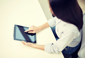 Image showing close up of woman hands with tablet pc at office