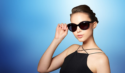 Image showing beautiful young woman in elegant black sunglasses