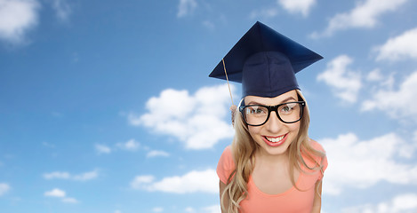 Image showing smiling young student woman in mortarboard