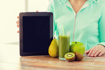 Image showing close up of woman hands tablet pc and fruit juice
