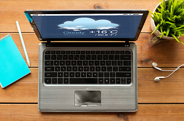 Image showing close up of laptop computer with weather forecast