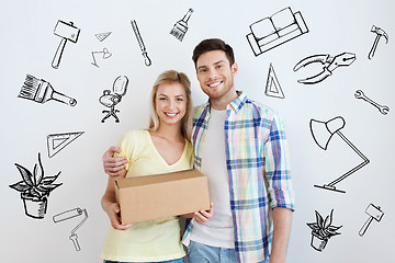 Image showing smiling couple with box moving to new home