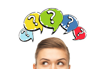 Image showing happy young woman head with question marks