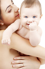 Image showing clean happy baby in mother hands