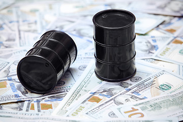 Image showing Oil drums on US dollars background