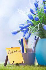 Image showing Adhesive note with Vacation text at green office