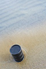 Image showing Oil barrel abandoned at the sea coast