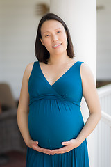 Image showing Portrait of Young Pregnant Chinese Woman on the Front Porch