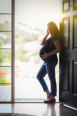 Image showing Chinese Pregnant Woman Standing in Doorway