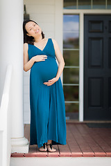 Image showing Portrait of Young Pregnant Chinese Woman on the Front Porch