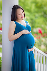 Image showing Portrait of Young Pregnant Chinese Woman on the Front Porch