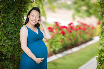 Image showing Young Pregnant Chinese Woman Portrait in Park