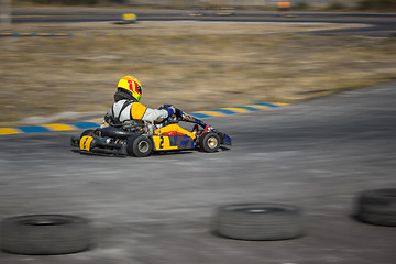 Image showing Karting - driver in helmet on kart circuit