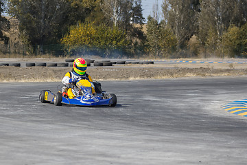 Image showing Karting - driver in helmet on kart circuit