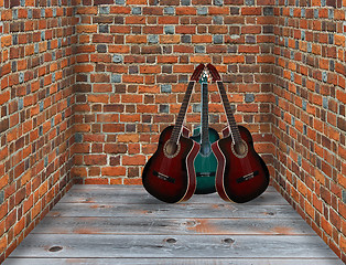 Image showing three guitars in the corner of the room