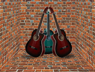 Image showing three guitars in the corner of the brick room