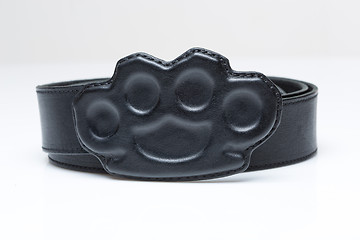 Image showing black belt with a buckle in the form of brass knuckles