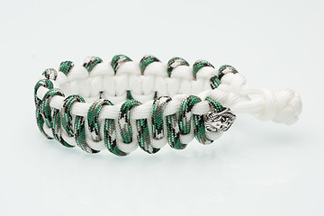 Image showing green braided bracelet on white background