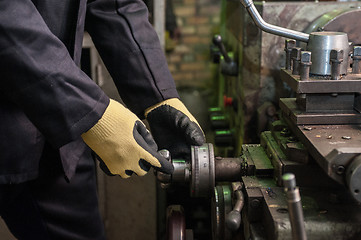 Image showing worker in protective gloves