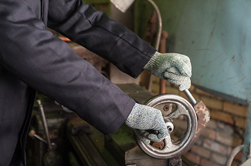 Image showing worker in protective gloves