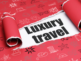 Image showing Travel concept: black text Luxury Travel under the piece of  torn paper