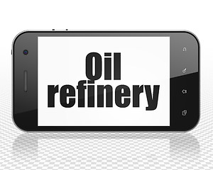 Image showing Manufacuring concept: Smartphone with Oil Refinery on display