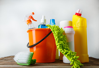 Image showing Bucket with cleaning items on light background