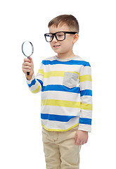 Image showing little boy in eyeglasses with magnifying glass