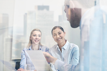 Image showing group of smiling businesspeople meeting in office