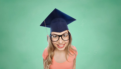 Image showing smiling young student woman in mortarboard