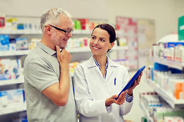 Image showing pharmacist with tablet pc and senior man