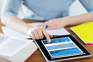 Image showing close up of woman with chart on tablet pc