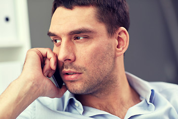 Image showing face of young businessman calling on smartphone