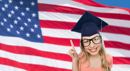 Image showing smiling young student woman in mortarboard