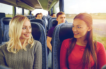 Image showing happy young women talking in travel bus