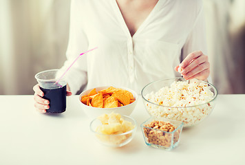 Image showing close up of woman with junk food and cola cup