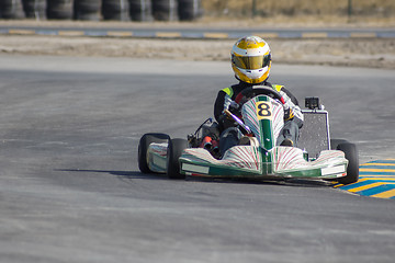 Image showing Karting - driver in helmet on kart circuit