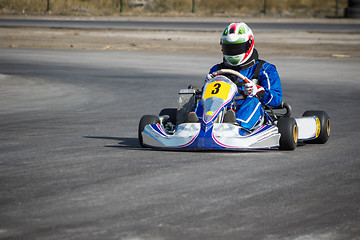 Image showing Karting - driver in helmet on kart circuit