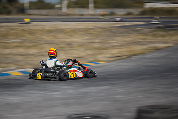 Image showing Karting - driver in helmet on kart circuit