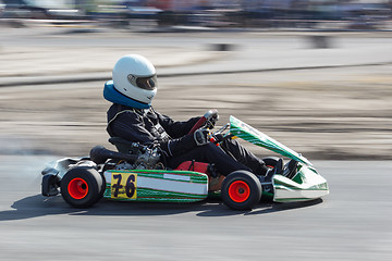 Image showing Karting - driver in helmet on kart circuit