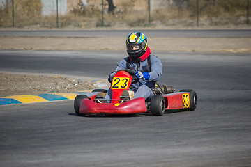 Image showing Karting - driver in helmet on kart circuit