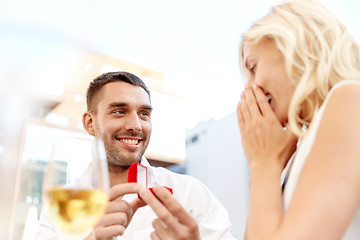 Image showing man with engagement ring making proposal to woman