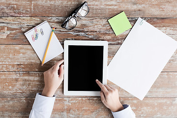 Image showing close up of female hands with tablet pc and coffee