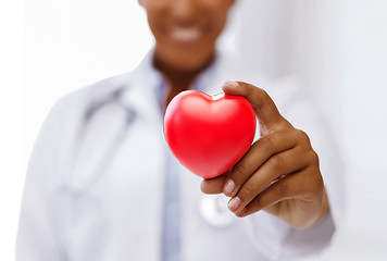 Image showing african female doctor with red heart