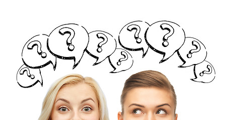 Image showing happy young women faces with question marks