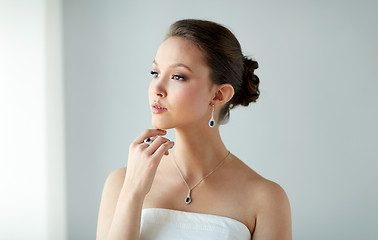 Image showing beautiful woman with earring, ring and pendant