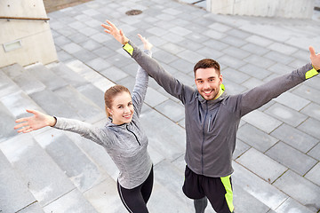 Image showing happy smiling couple outdoors on city street